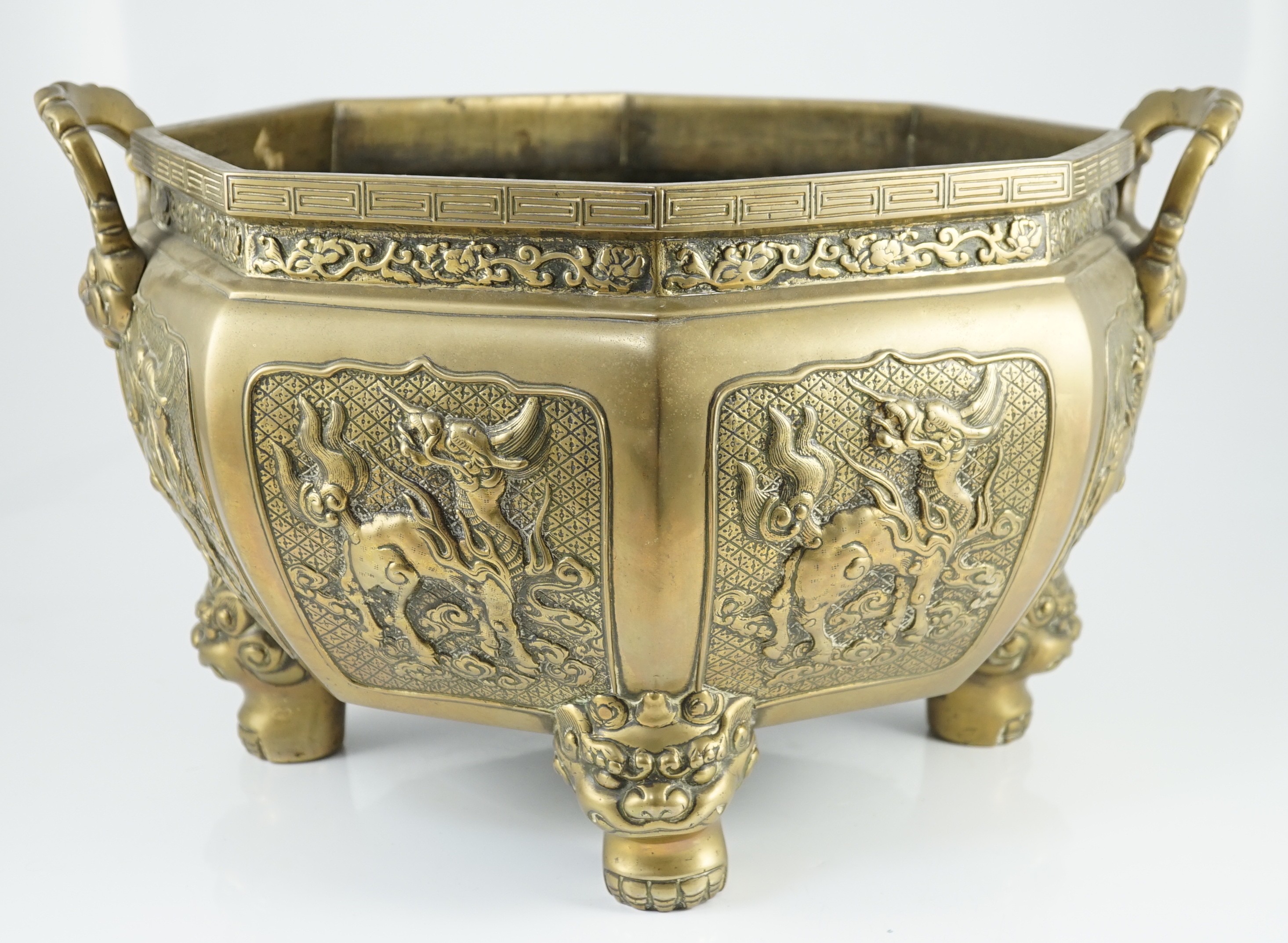 A large Chinese polished bronze octagonal jardiniere, 19th century, 48cm wide at handles, slight faults